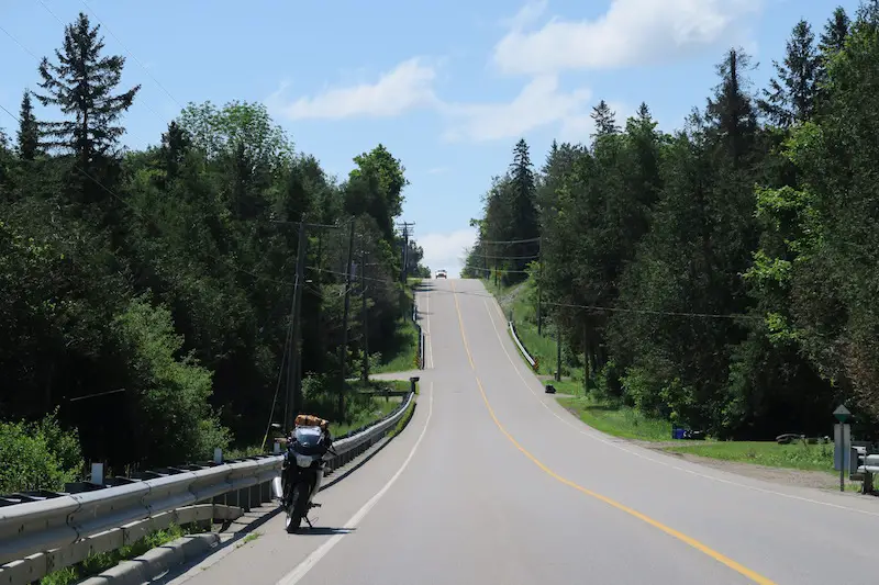 2011 Honda cbr250r beside one of the Grand River plaques on the highway near puslinch