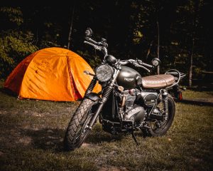 motorcycle camping with a tent and triumph bike
