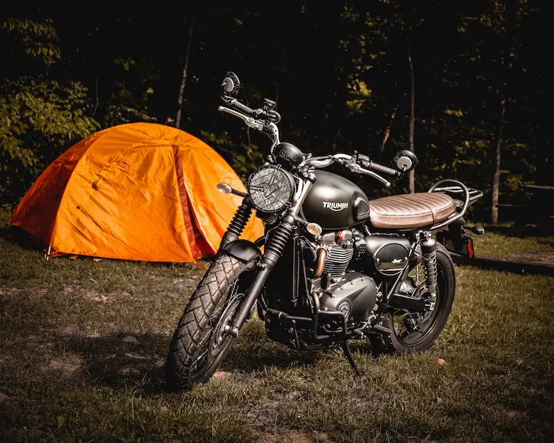 motorcycle camping with a tent and triumph bike