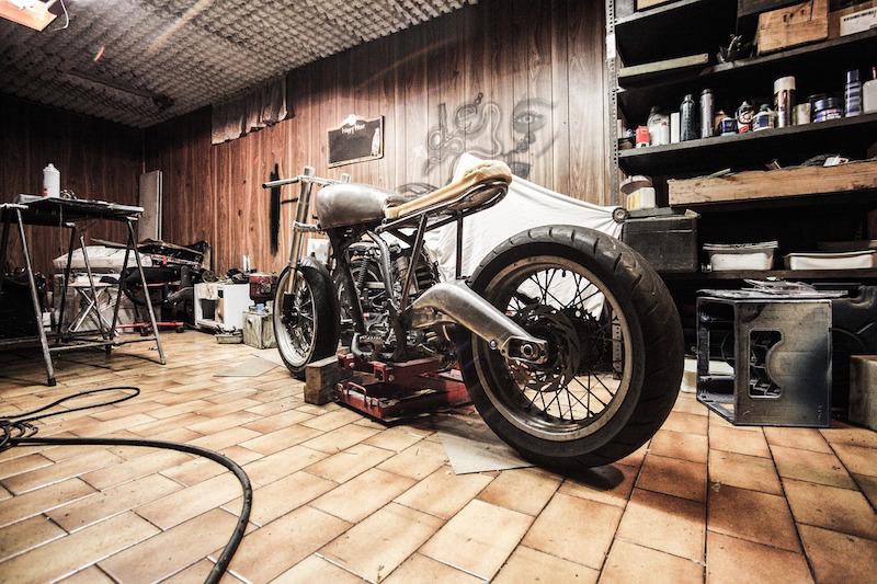 Old motorcycle being worked on in the garage