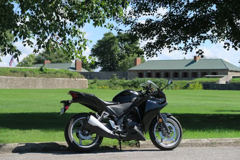 honda cbr250r parked out front of old fort erie