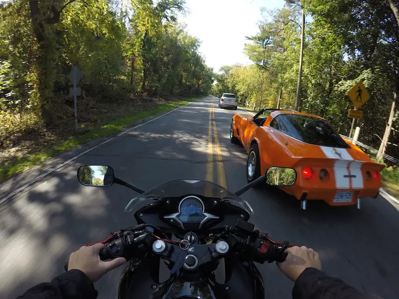 motorcycle overtake mustang