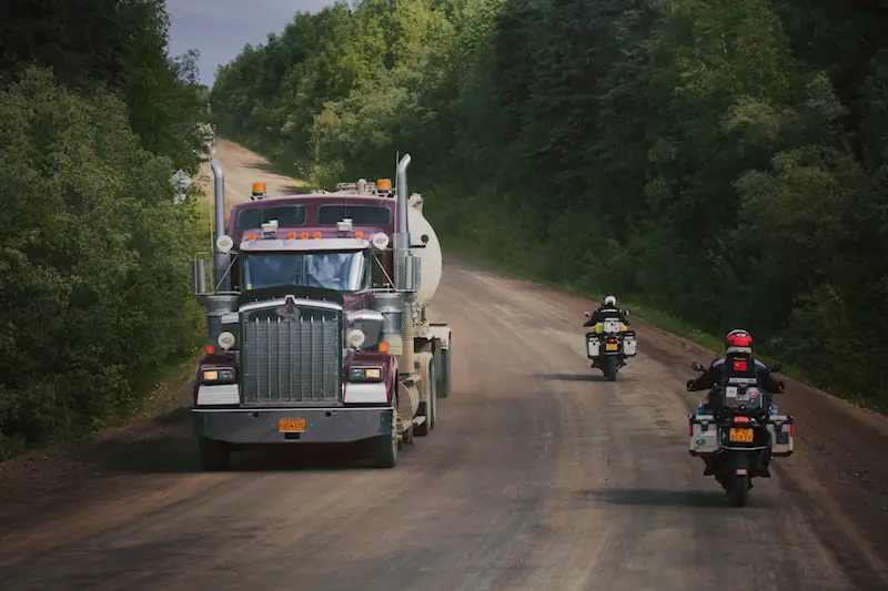 riding motorcycle on logging road