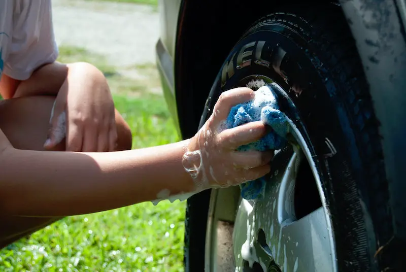 cleaning tires on a car