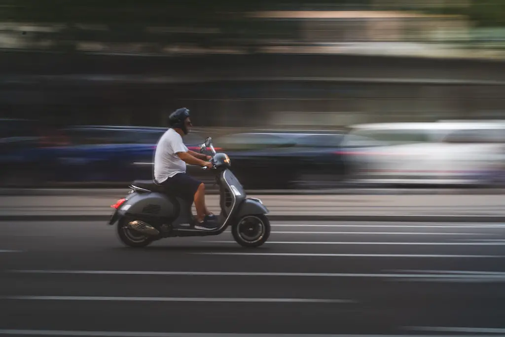 riding a scooter on the street