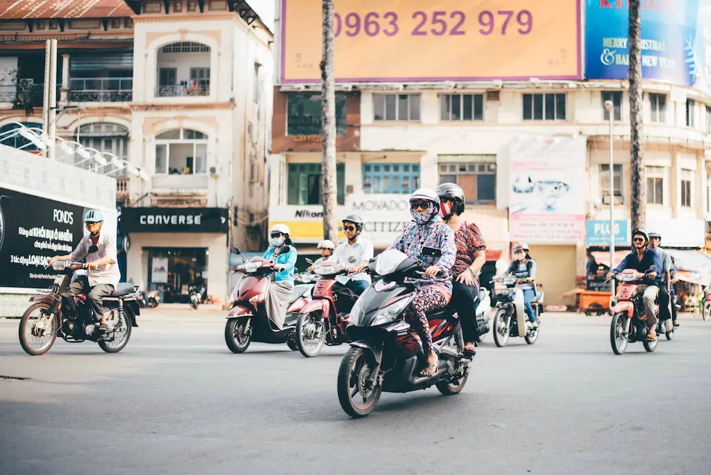 riding scooter in traffic